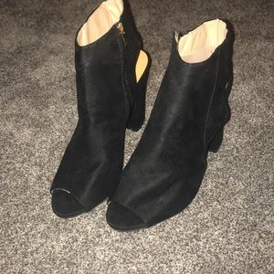 Black suede peep toe heels with zipper